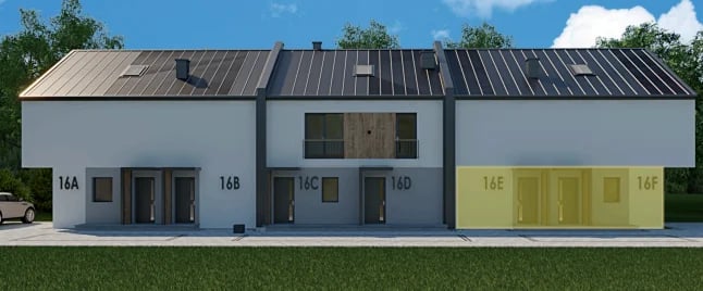 Modern industrial building with white and yellow facades, metal roof, and numbered unit doors under blue sky
